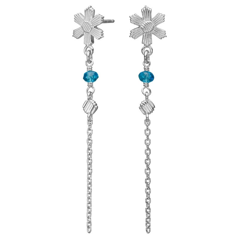 Nordahl Andersen blomstøreringe fra Nordahl Jewellery i rhodineret 925 sterlingsølv med blå sten og slank kæde.