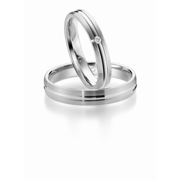 Tidløse Gerstner vielsesringe i 14 eller 9 karat hvidguld med 0,02 ct diamanter i silkemat og blank finish – sæt med dame- og herrering.
