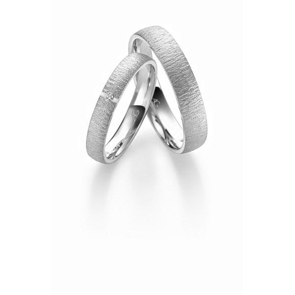 Unikt sæt Gerstner vielsesringe i 9 eller 14 karat hvidguld med 0,015 ct diamant