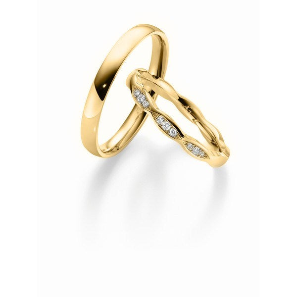 Smukt sæt Gerstner vielsesringe i 9 eller 14 karat guld med 9 diamanter (0,06 ct)