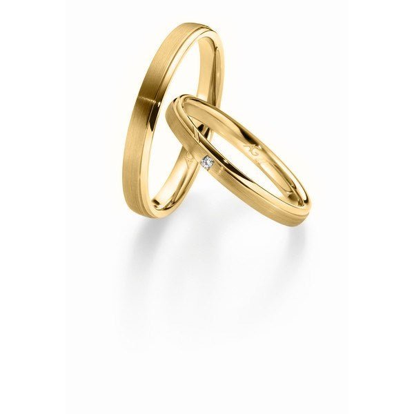 Gerstner Smukke vielsesringe i 9 eller 14 karat guld med silkemat finish og 0,015 ct diamant i damering.