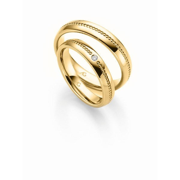 Flotte Gerstner vielsesringe i 9 eller 14 karat guld med hulmønster og 0,02 ct diamant