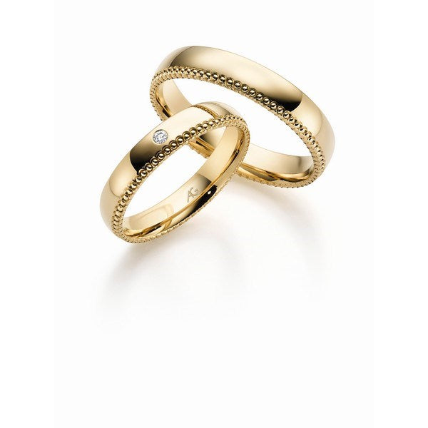 Klassiske Gerstner vielsesringe i 14 eller 9 karat guld med 0,02 ct diamant og diskret mønster fra Gerstner.