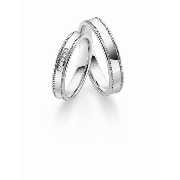 Unikke Gerstner vielsesringe i 14 eller 9 karat hvidguld med hulmønster og 0,025 ct diamanter på damering.