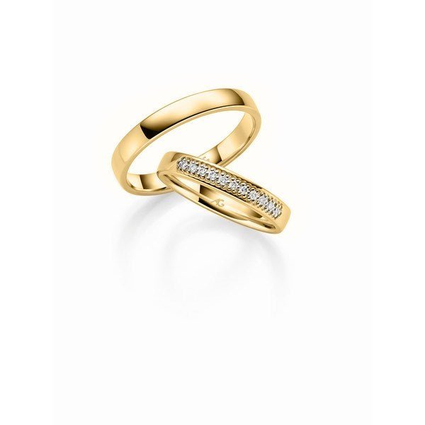Smukke Gerstner vielsesringe i 14 karat guld med kantet profil og 0,11 ct diamanter i damering – blankpolerede.