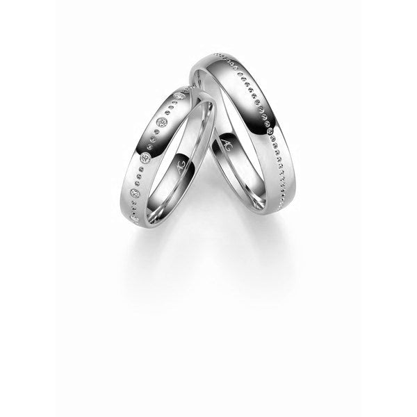 Klassiske Gerstner vielsesringe i 9 eller 14 karat hvidguld med 0,05 ct diamanter og blank poleret finish.