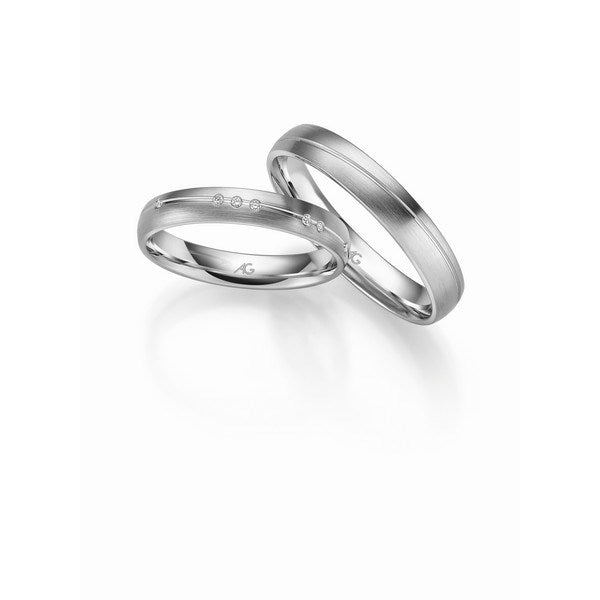 Eksklusive Gerstner vielsesringe i 9 eller 14 karat hvidguld med silkemat overflade og 0,075 ct diamanter – damering og herrering.