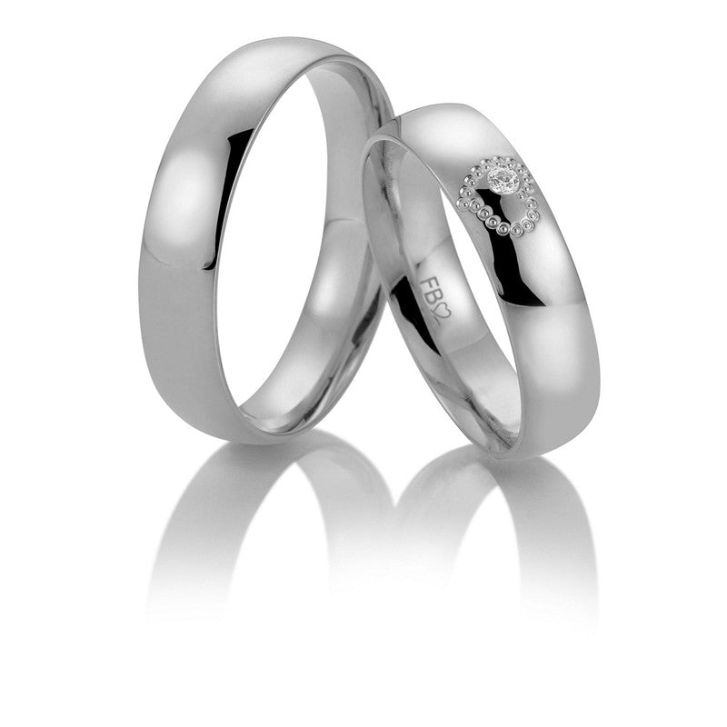 Romantisk Breuning vielsesringe i 9 eller 14 karat hvidguld med 0,025 ct diamant i hjerte