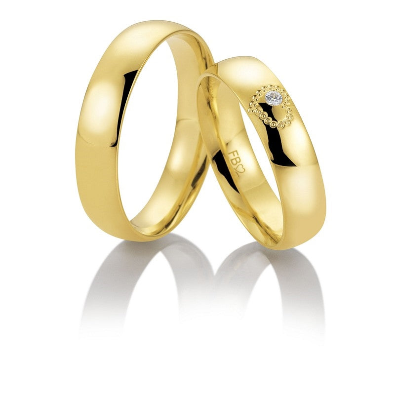 Romantiske Breuning vielsesringe i 8 eller 14 karat guld med 0,025 ct diamant i hjerte