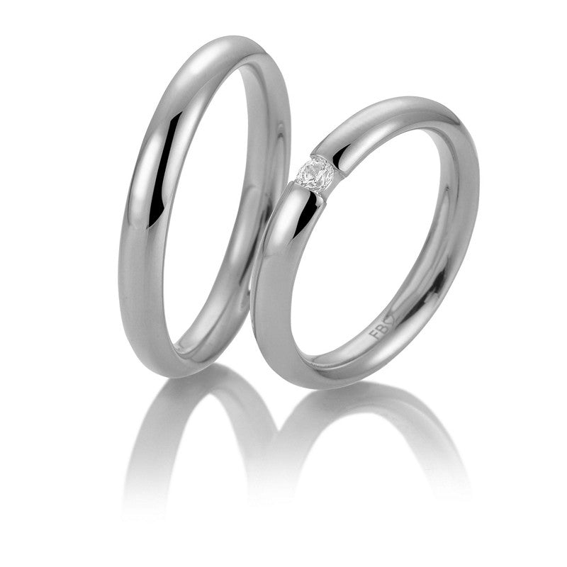 Eksklusive Breuning vielsesringe i 9 eller 14 karat hvidguld med blank overflade og diamant 0,08 ct.