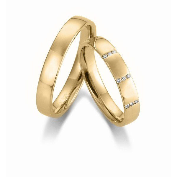 Ekstra flotte Gerstner vielsesringe i 14 eller 9 karat guld med 0,045 ct diamanter og blank overflade.