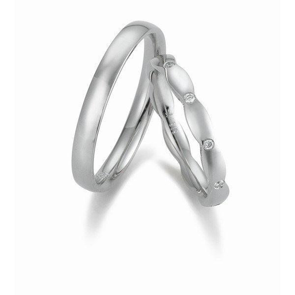 Romantiske Gerstner vielsesringe i 14 karat hvidguld med 0,10 ct diamanter og blank overflade – 3 mm bredde.
