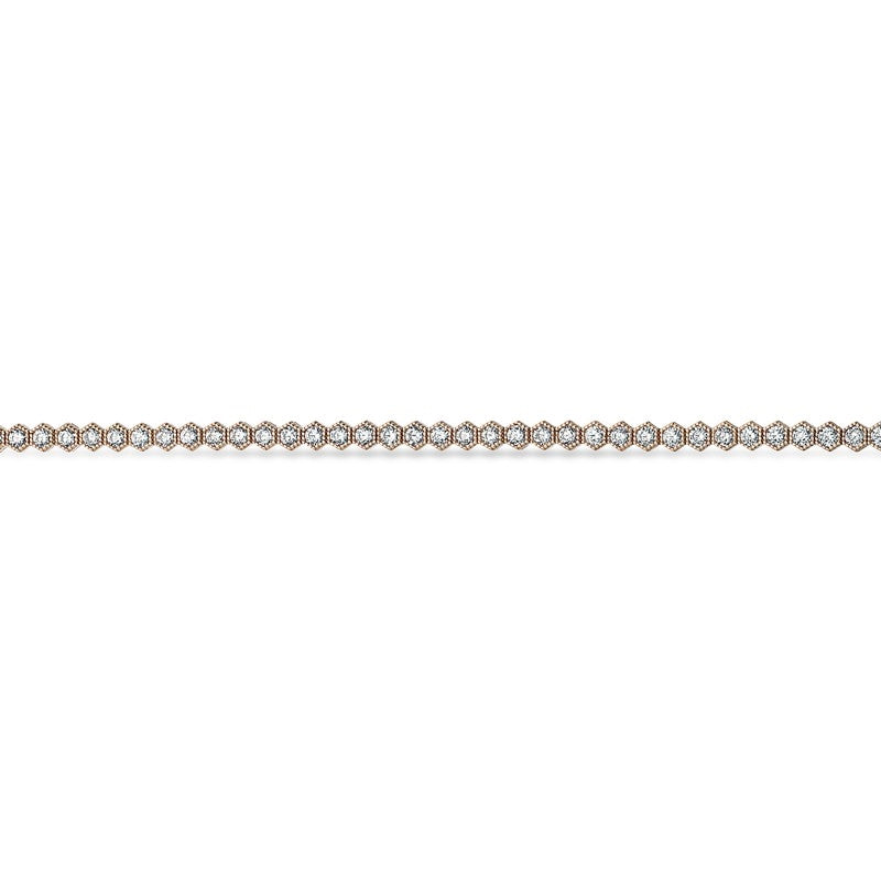 Scrouples tennisarmbånd i 8 karat guld med zirkonia i afrundede sekskantede fatninger.