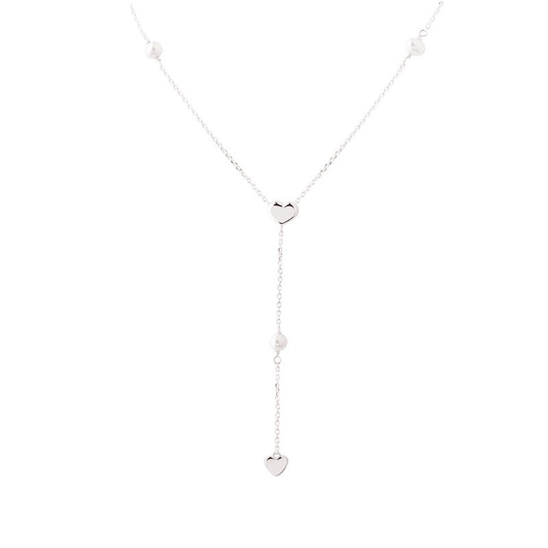 Aqua Dulce Karla Y-halskæde i sterlingsølv med ferskvandsperler, hjerter og sølvkugler, 45–48 cm.