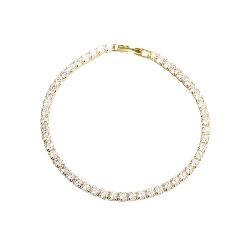 Aqua Dulce tennisarmbånd i forgyldt sølv med zirkonia 18 cm – elegant armbånd med klare sten og foldelås.