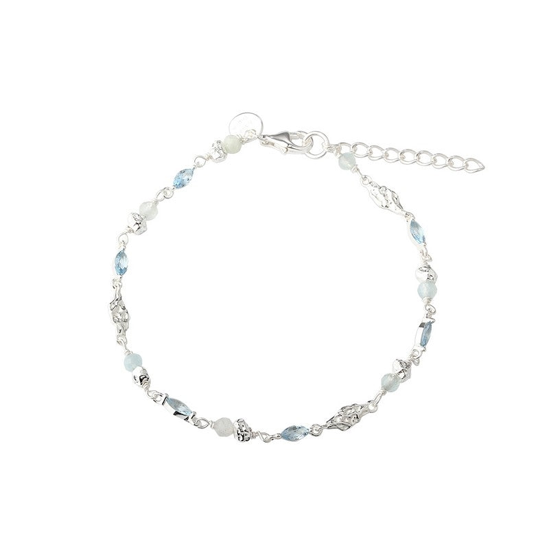 Sinna armbånd i 925 sterlingsølv med aquamarin og blå zirkonia fra Aqua Dulce 17–20 cm.