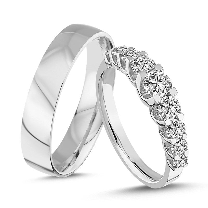 Unikke Nuran vielsesringe i 14 karat hvidguld med damering med 9 diamanter i alt 1,00 ct og blank herrevinge på 6 mm.
