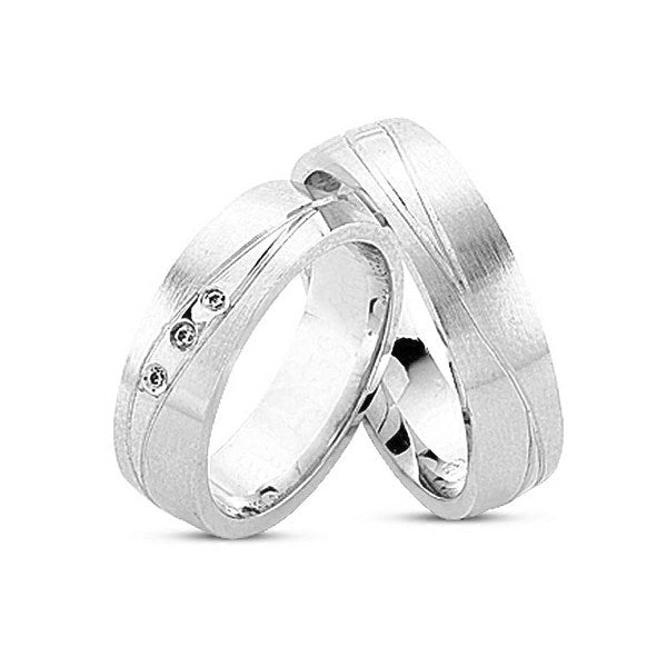 Smukke Nuran vielsesringe i 14 kt hvidguld med graveret rille og 3 x 0,01 ct diamanter – silkemat og blank overflade.