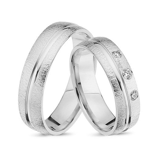Eksklusive Nuran vielsesringe i 14 kt hvidguld med mat overflade, blankt bånd og 0,10 ct diamanter.
