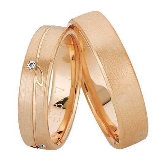 Smukke Nuran vielsesringe i 14 karat guld med 0,04 ct diamant og bladmotiv