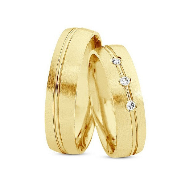 Særlige Nuran vielsesringe i 8 eller 14 karat silkemat guld med 0,06 ct diamanter og todelt design.