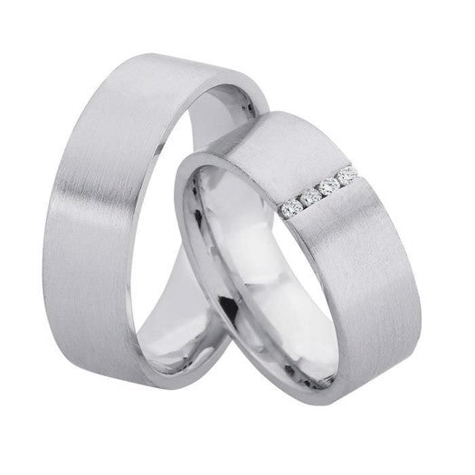 Stilfulde Nuran vielsesringe i rhodineret sølv med frostet overflade og 4 diamanter (4 x 0,015 ct).