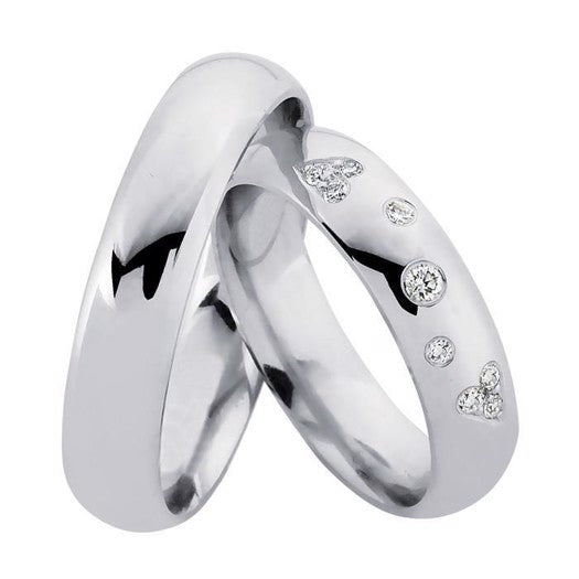 Tidløse Nuran vielsesringe i rhodineret 925 sterlingsølv med 9 diamanter (8 x 0,01 + 1 x 0,02 ct) fra Nuran.