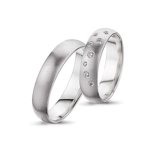 Unikke Nuran vielsesringe i 14 kt hvidguld med 0,11 ct diamanter – damesæt med 8 diamanter og herre uden sten.