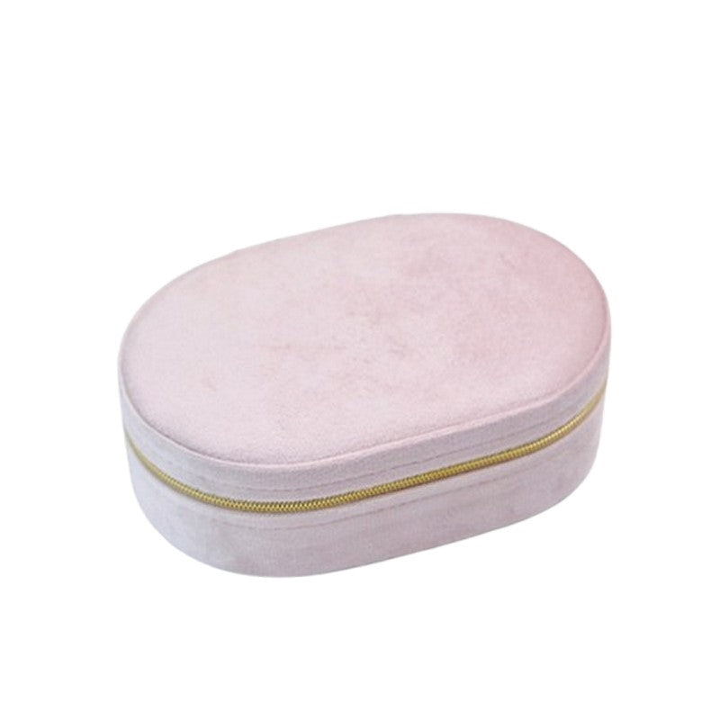 Ovalt smykkeskrin i rosa velour fra Smykkecenter med lynlås og flere rum til smykkeopbevaring.