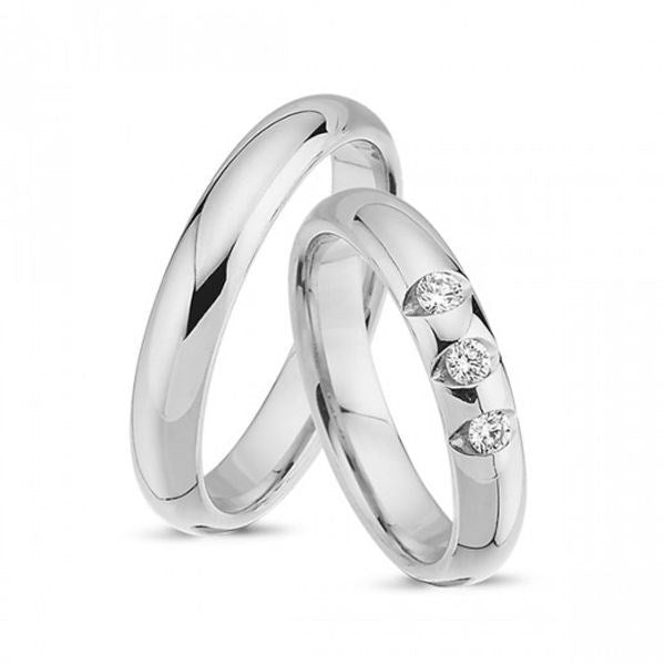 Flotte Nuran vielsesringe i 14 karat hvidguld med 0,24 ct diamanter – klassiske, blanke ringe med 5 mm bredde.