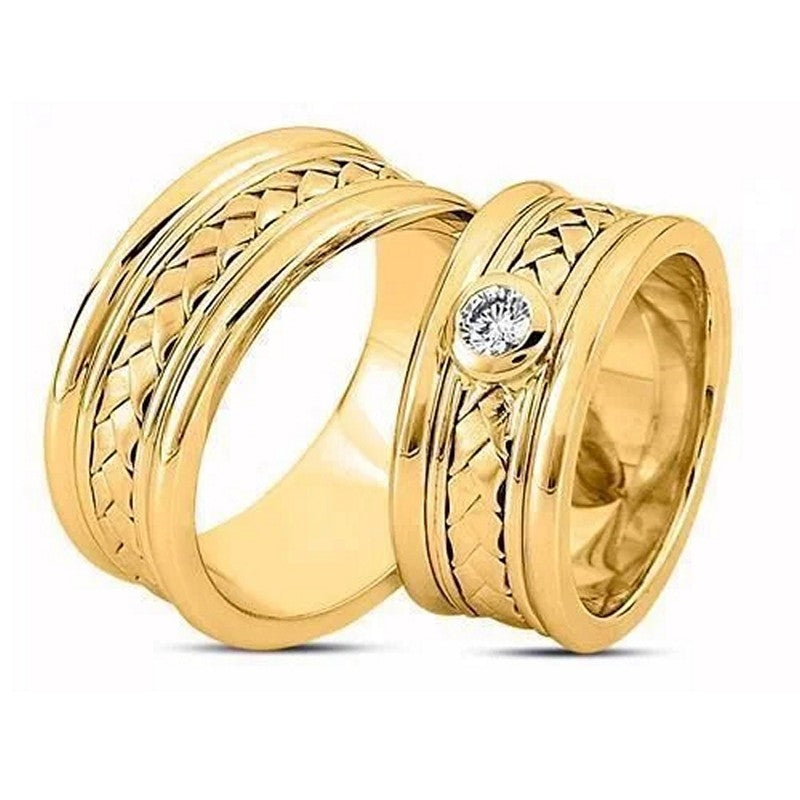 Særlig Nuran vielsesringe i 14 karat guld med flettet design og 0,20 ct diamant i damering fra Nuran.