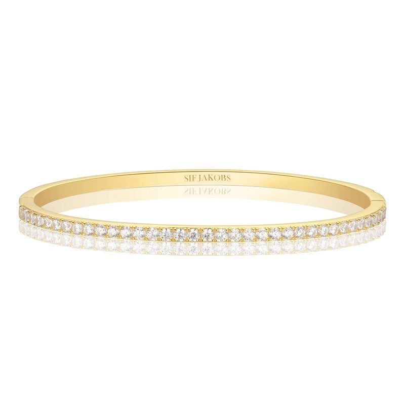 Sif Jakobs Ellisse Bangle i forgyldt sterlingsølv med klare zirkonia – elegant armbånd.