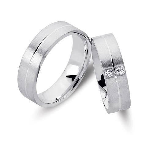 Smagfulde Nuran vielsesringe i rhodineret sølv med 2 zirkonia, 6 mm