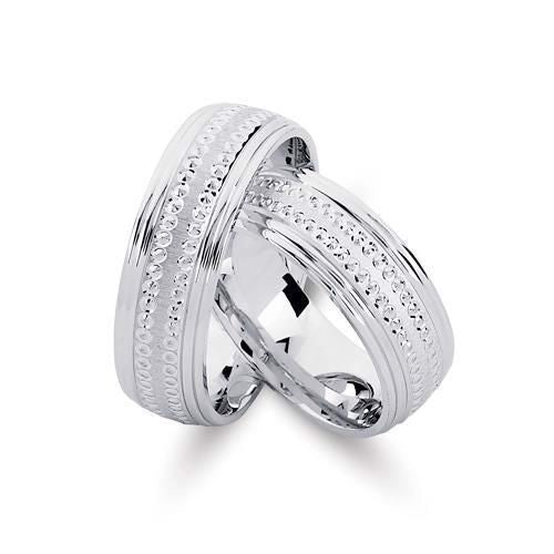 Særlige Nuran vielsesringe i rhodineret sølv med prikmønster