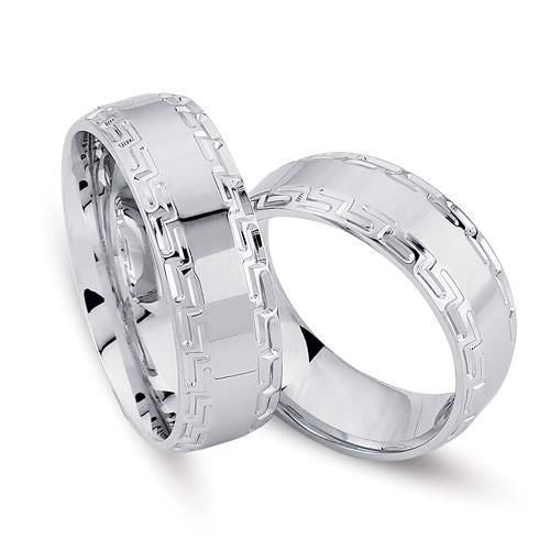 Flotte Nuran vielsesringe i rhodineret sølv med struktureret kant, 6,5 mm.