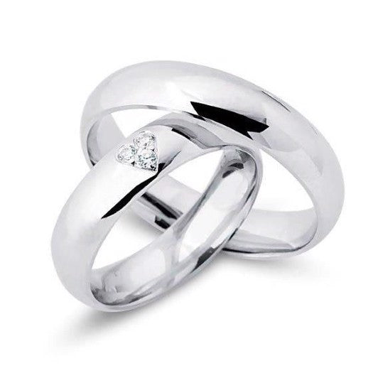 Klassiske Nuran vielsesringe i rhodineret sølv med 3 zirkoner formet som hjerte.