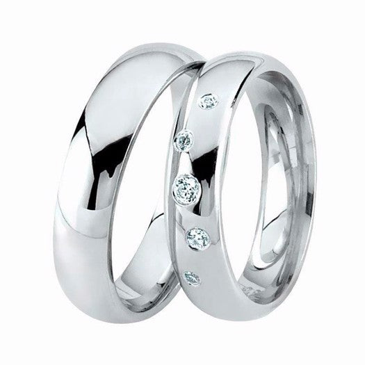Smukke Nuran vielsesringe i rhodineret sølv med 5 zirkonia – klassisk sæt med blankpolerede ringe.