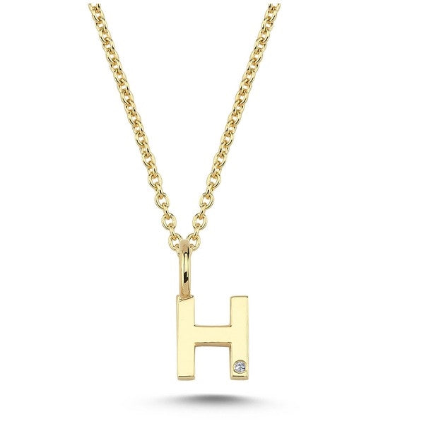 Nuran bogstavsvedhæng i 14 karat guld med diamant 6,5 mm