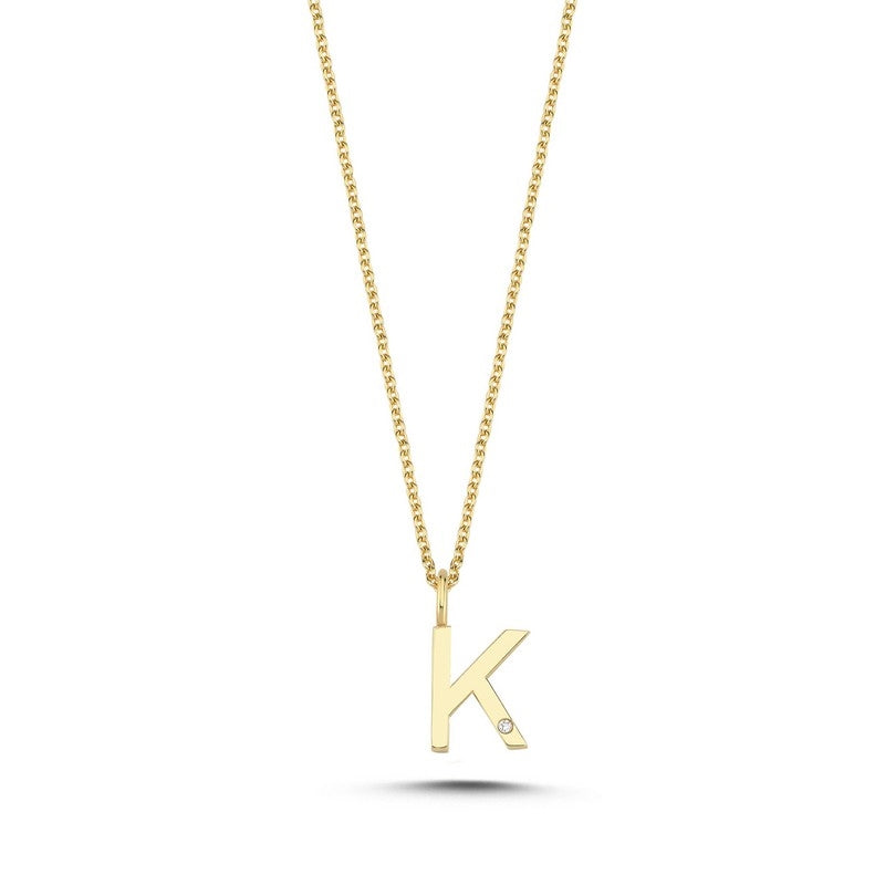 Nuran bogstavsvedhæng i 14 karat guld med diamant