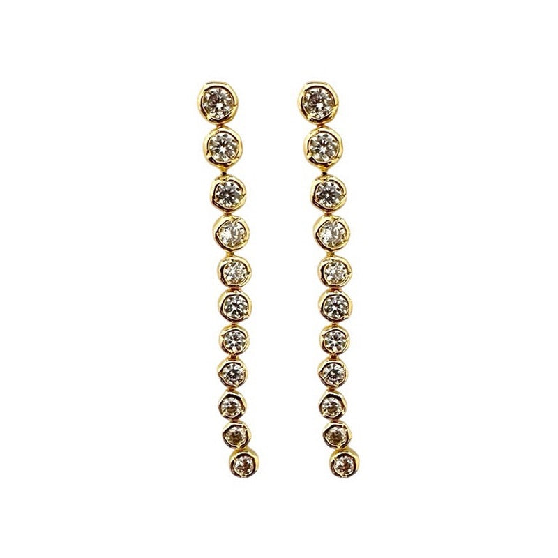 Pico Copenhagen Ziva Crystal Studs forgyldte messingøreringe med klare krystaller i lang, kædeagtig form.