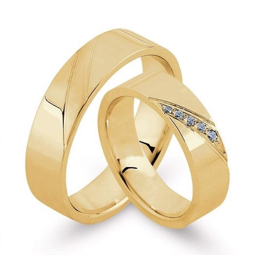 Eksklusive Nuran vielsesringe i 8 eller 14 karat guld med 0,07 ct diamanter