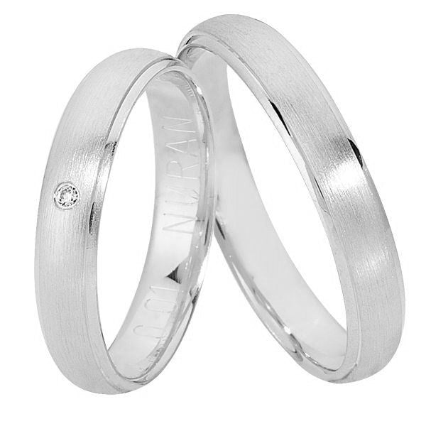 Eksklusiv Nuran vielsesringe i 14 karat hvidguld med børstet overflade og 0,01 ct diamant – sæt med dame- og herrering.