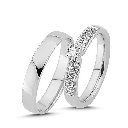 Eksklusive Nuran vielsesringe i 14 karat hvidguld med 0,28 ct diamanter – klassisk og tidløst design.