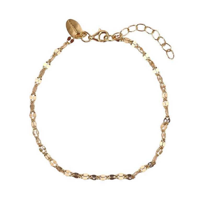 Aqua Dulce Marisol armbånd i forgyldt sterlingsølv 17–20 cm med små facetterede led.