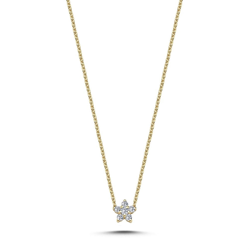 Stella vedhæng fra Nuran i 14 karat guld med 0,11 ct diamanter formet som en stjerne.