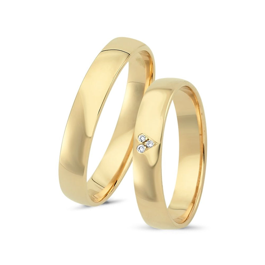 Romantiske Nuran Sweet Love vielsesringe i 14 kt guld med 0,015 ct diamanter formet som hjerte.
