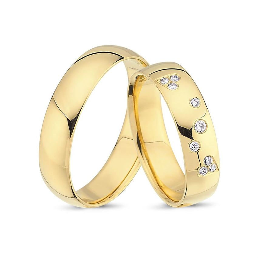 Eksklusive Nuran vielsesringe i 14 kt guld med 9 diamanter (8 x 0,01 ct og 1 x 0,02 ct)