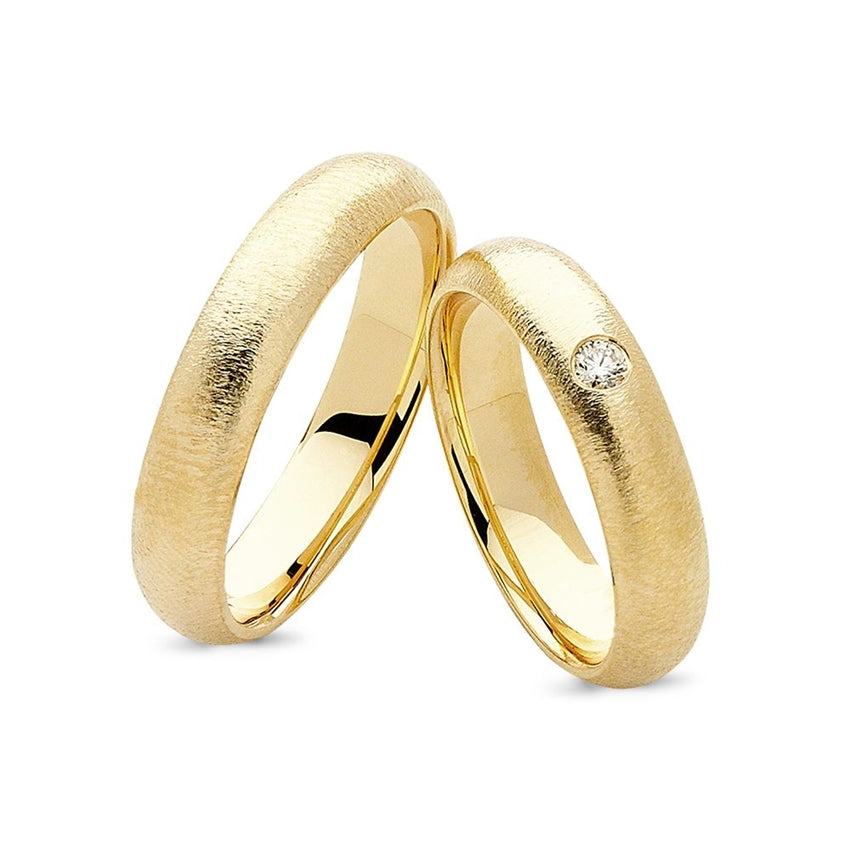 Flotte Nuran vielsesringe i 14 karat guld med 0,05 ct diamant